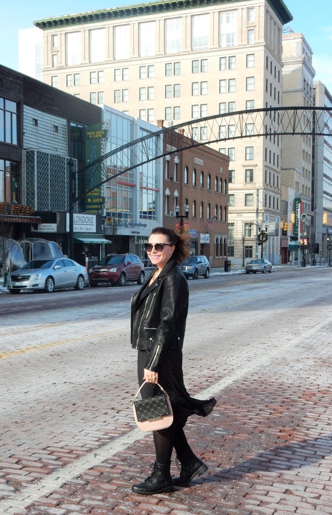 Sarah In Style, SarahInStyle.com, Sarah Meyer, Chicago Fashion Blogger, Michigan Fashion Blogger, Midwest Fashion Blogger, Flint Michigan, Downtown Flint, Flint MI, Michigan Cities, Leather Moto Jacket, Topshop Moto Jacket, J. Crew Black and Gold Polka Dot Dress, Pink and Black Studded Purse, Capitol Theater Flint, Kate Spade Sunglasses, Kate Spade Heart Ring, Gold Heart Ring, Tres Colori, Custom Rings, Year Ring, Chunky Gold Rings, Chunky Gold Necklace, Chunky Gold Jewelry, Shine Bright in Fashion, Shine Bright, Who What Wear, What to Wear, Outfit of the Day, 90's grunge fashion, 90's punk fashion, 90's fashion back in style