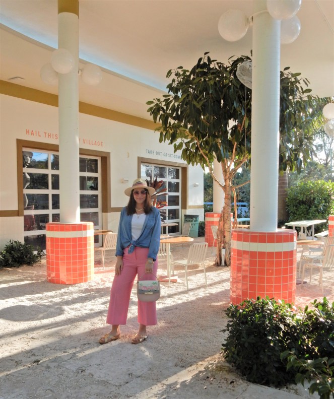 Sarah In Style, SarahInStyle, SarahInStyle.com, Sarah Meyer, Fashion Blog, Fashion Blogger, Chicago Fashion Blogger, Florida Fashion Blogger, Fashion Inspiration from blogs, What to wear in spring, Spring 2021 Fashion, Spring 2021 Fashion Trends, Styling bright pants, pink pants, colorful spring pants, colorful spring wardrobe, classic chambray button down, joules hat, pink sunglasses, lilly pulitzer sandals, gold criss cross sandals, chunky gold jewelry, fashion inspiration for spring, what to wear in Florida in spring, Whitney's Florida, Whitney's Longboat Key, retro fashion shoot, mid-century modern in Florida, Classic spring looks, Classic spring fashion, styling tips from bloggers, retro gas station, best restaurants in Sarasota, mid-century sarasota, what to do in Sarasota, Where to eat near Sarasota