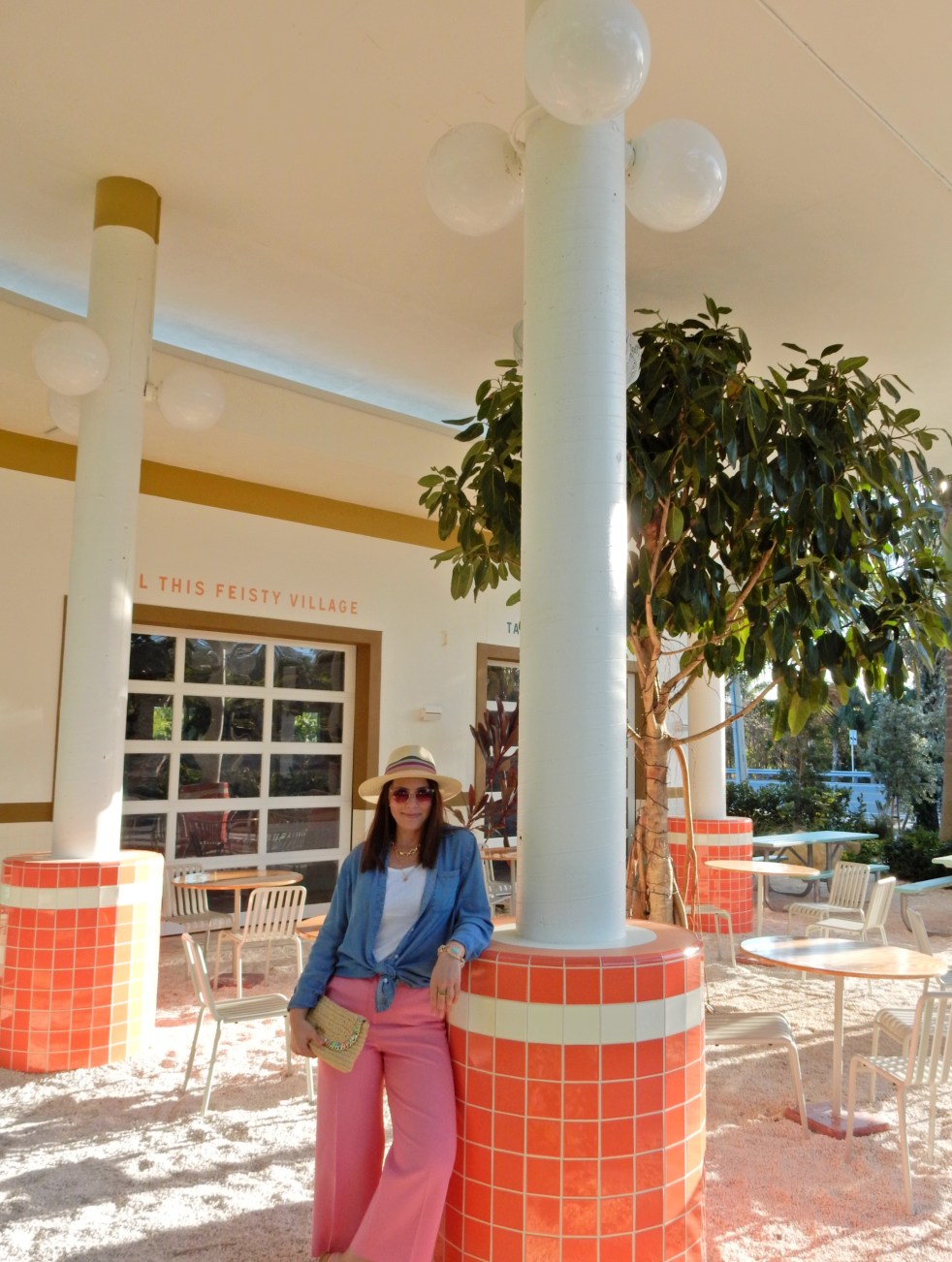 Sarah In Style, SarahInStyle, SarahInStyle.com, Sarah Meyer, Fashion Blog, Fashion Blogger, Chicago Fashion Blogger, Florida Fashion Blogger, Fashion Inspiration from blogs, What to wear in spring, Spring 2021 Fashion, Spring 2021 Fashion Trends, Styling bright pants, pink pants, colorful spring pants, colorful spring wardrobe, classic chambray button down, joules hat, pink sunglasses, lilly pulitzer sandals, gold criss cross sandals, chunky gold jewelry, fashion inspiration for spring, what to wear in Florida in spring, Whitney's Florida, Whitney's Longboat Key, retro fashion shoot, mid-century modern in Florida, Classic spring looks, Classic spring fashion, styling tips from bloggers, retro gas station, best restaurants in Sarasota, mid-century sarasota, what to do in Sarasota, Where to eat near Sarasota