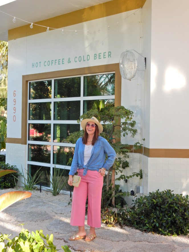 Sarah In Style, SarahInStyle, SarahInStyle.com, Sarah Meyer, Fashion Blog, Fashion Blogger, Chicago Fashion Blogger, Florida Fashion Blogger, Fashion Inspiration from blogs, What to wear in spring, Spring 2021 Fashion, Spring 2021 Fashion Trends, Styling bright pants, pink pants, colorful spring pants, colorful spring wardrobe, classic chambray button down, joules hat, pink sunglasses, lilly pulitzer sandals, gold criss cross sandals, chunky gold jewelry, fashion inspiration for spring, what to wear in Florida in spring, Whitney's Florida, Whitney's Longboat Key, retro fashion shoot, mid-century modern in Florida, Classic spring looks, Classic spring fashion, styling tips from bloggers, retro gas station, best restaurants in Sarasota, mid-century sarasota, what to do in Sarasota, Where to eat near Sarasota