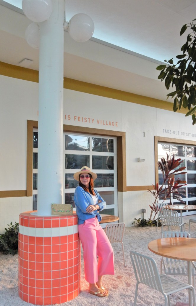 Sarah In Style, SarahInStyle, SarahInStyle.com, Sarah Meyer, Fashion Blog, Fashion Blogger, Chicago Fashion Blogger, Florida Fashion Blogger, Fashion Inspiration from blogs, What to wear in spring, Spring 2021 Fashion, Spring 2021 Fashion Trends, Styling bright pants, pink pants, colorful spring pants, colorful spring wardrobe, classic chambray button down, joules hat, pink sunglasses, lilly pulitzer sandals, gold criss cross sandals, chunky gold jewelry, fashion inspiration for spring, what to wear in Florida in spring, Whitney's Florida, Whitney's Longboat Key, retro fashion shoot, mid-century modern in Florida, Classic spring looks, Classic spring fashion, styling tips from bloggers