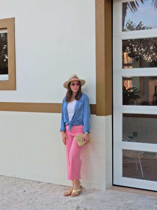 Sarah In Style, SarahInStyle, SarahInStyle.com, Sarah Meyer, Fashion Blog, Fashion Blogger, Chicago Fashion Blogger, Florida Fashion Blogger, Fashion Inspiration from blogs, What to wear in spring, Spring 2021 Fashion, Spring 2021 Fashion Trends, Styling bright pants, pink pants, colorful spring pants, colorful spring wardrobe, classic chambray button down, joules hat, pink sunglasses, lilly pulitzer sandals, gold criss cross sandals, chunky gold jewelry, fashion inspiration for spring, what to wear in Florida in spring, Whitney's Florida, Whitney's Longboat Key, retro fashion shoot, mid-century modern in Florida, Classic spring looks, Classic spring fashion, styling tips from bloggers