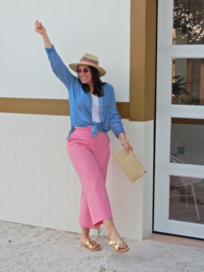 Sarah In Style, SarahInStyle, SarahInStyle.com, Sarah Meyer, Fashion Blog, Fashion Blogger, Chicago Fashion Blogger, Florida Fashion Blogger, Fashion Inspiration from blogs, What to wear in spring, Spring 2021 Fashion, Spring 2021 Fashion Trends, Styling bright pants, pink pants, colorful spring pants, colorful spring wardrobe, classic chambray button down, joules hat, pink sunglasses, lilly pulitzer sandals, gold criss cross sandals, chunky gold jewelry, fashion inspiration for spring, what to wear in Florida in spring, Whitney's Florida, Whitney's Longboat Key, retro fashion shoot, mid-century modern in Florida, Classic spring looks, Classic spring fashion, styling tips from bloggers, retro gas station, best restaurants in Sarasota, mid-century sarasota, what to do in Sarasota, Where to eat near Sarasota
