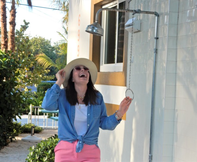 Sarah In Style, SarahInStyle, SarahInStyle.com, Sarah Meyer, Fashion Blog, Fashion Blogger, Chicago Fashion Blogger, Florida Fashion Blogger, Fashion Inspiration from blogs, What to wear in spring, Spring 2021 Fashion, Spring 2021 Fashion Trends, Styling bright pants, pink pants, colorful spring pants, colorful spring wardrobe, classic chambray button down, joules hat, pink sunglasses, lilly pulitzer sandals, gold criss cross sandals, chunky gold jewelry, fashion inspiration for spring, what to wear in Florida in spring, Whitney's Florida, Whitney's Longboat Key, retro fashion shoot, mid-century modern in Florida, Classic spring looks, Classic spring fashion, styling tips from bloggers, retro gas station, best restaurants in Sarasota, mid-century sarasota, what to do in Sarasota, Where to eat near Sarasota