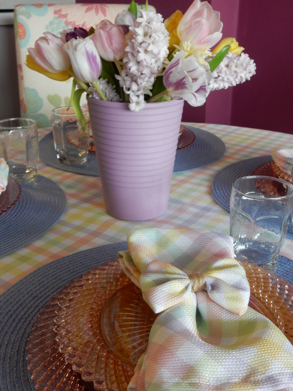 Sarah In Style, SarahInStyle.com, Sarah Meyer, Dining Decor, Hoppy Easter, Easter Table, Easter Decorating, Easter Decorations, Easter tablescapes, Spring tablescapes, spring tablescape, decorating for Easter, incorporating family traditions, where did the easter bunny originate, where is the easter bunny from, why do we hide easter eggs, cute table decor, miss america depressrion glass, pink miss america glass, plaid tablecloth, plaid napkins, bow napkin rings, table decorating ideas, wedding shower tables, baby shower tables, springtime decor. Easter 2021, Bed Bath and Beyond tableware