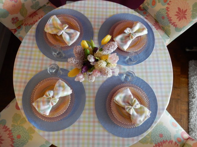 Sarah In Style, SarahInStyle.com, Sarah Meyer, Dining Decor, Hoppy Easter, Easter Table, Easter Decorating, Easter Decorations, Easter tablescapes, Spring tablescapes, spring tablescape, decorating for Easter, incorporating family traditions, where did the easter bunny originate, where is the easter bunny from, why do we hide easter eggs, cute table decor, miss america depressrion glass, pink miss america glass, plaid tablecloth, plaid napkins, bow napkin rings, table decorating ideas, wedding shower tables, baby shower tables, springtime decor. Easter 2021, Bed Bath and Beyond tableware