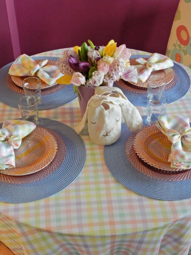 Sarah In Style, SarahInStyle.com, Sarah Meyer, Dining Decor, Hoppy Easter, Easter Table, Easter Decorating, Easter Decorations, Easter tablescapes, Spring tablescapes, spring tablescape, decorating for Easter, incorporating family traditions, where did the easter bunny originate, where is the easter bunny from, why do we hide easter eggs, cute table decor, miss america depressrion glass, pink miss america glass, plaid tablecloth, plaid napkins, bow napkin rings, table decorating ideas, wedding shower tables, baby shower tables, springtime decor. Easter 2021, Bed Bath and Beyond tableware