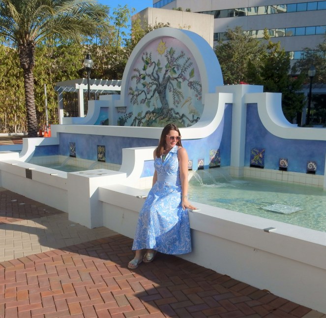 Lilly Pulitzer Mermaid Dress, Blue and White Lilly Pulitzer Dress, Lilly Pulitzer Chrisella Dress, Lilly Pulitzer mermaid print, mermaid pattern dress, Chic in blue and white, pink sunglasses, bold statement necklaces, blue and green gem necklace, Florida, fashion, Southern style, perfect country club dress, country club fashion, beach chic, perfect summer dress, belted shirt dress, most flattering dress, summer fashion 2021, summer style 2021, mermaid meaning, what do mermaids symbolize, Sarah In Style, SarahInStyle.com, Sarah Meyer, Chicago fashion blogger, fashion blogger summer style, Florida fashion blogger, Sarasota fountains, Sarasota waterfront, Sarasota blogger, adult mermaid dress