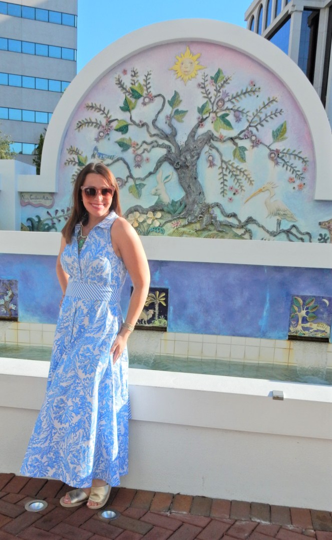 Lilly Pulitzer Mermaid Dress, Blue and White Lilly Pulitzer Dress, Lilly Pulitzer Chrisella Dress, Lilly Pulitzer mermaid print, mermaid pattern dress, Chic in blue and white, pink sunglasses, bold statement necklaces, blue and green gem necklace, Florida, fashion, Southern style, perfect country club dress, country club fashion, beach chic, perfect summer dress, belted shirt dress, most flattering dress, summer fashion 2021, summer style 2021, mermaid meaning, what do mermaids symbolize, Sarah In Style, SarahInStyle.com, Sarah Meyer, Chicago fashion blogger, fashion blogger summer style, Florida fashion blogger, Sarasota fountains, Sarasota waterfront, Sarasota blogger, adult mermaid dress