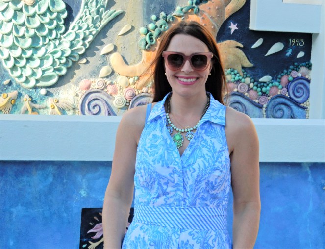 Lilly Pulitzer Mermaid Dress, Blue and White Lilly Pulitzer Dress, Lilly Pulitzer Chrisella Dress, Lilly Pulitzer mermaid print, mermaid pattern dress, Chic in blue and white, pink sunglasses, bold statement necklaces, blue and green gem necklace, Florida, fashion, Southern style, perfect country club dress, country club fashion, beach chic, perfect summer dress, belted shirt dress, most flattering dress, summer fashion 2021, summer style 2021, mermaid meaning, what do mermaids symbolize, Sarah In Style, SarahInStyle.com, Sarah Meyer, Chicago fashion blogger, fashion blogger summer style, Florida fashion blogger, Sarasota fountains, Sarasota waterfront, Sarasota blogger, adult mermaid dress