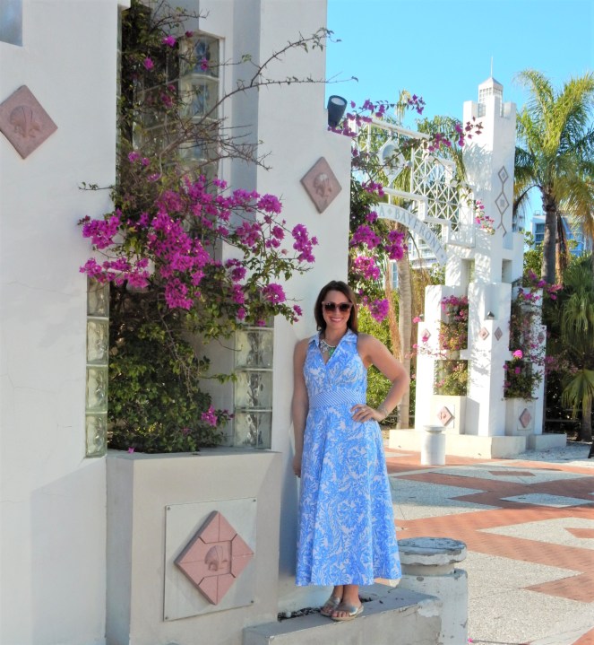 Lilly Pulitzer Mermaid Dress, Blue and White Lilly Pulitzer Dress, Lilly Pulitzer Chrisella Dress, Lilly Pulitzer mermaid print, mermaid pattern dress, Chic in blue and white, pink sunglasses, bold statement necklaces, blue and green gem necklace, Florida, fashion, Southern style, perfect country club dress, country club fashion, beach chic, perfect summer dress, belted shirt dress, most flattering dress, summer fashion 2021, summer style 2021, mermaid meaning, what do mermaids symbolize, Sarah In Style, SarahInStyle.com, Sarah Meyer, Chicago fashion blogger, fashion blogger summer style, Florida fashion blogger, Sarasota fountains, Sarasota waterfront, Sarasota blogger, adult mermaid dress