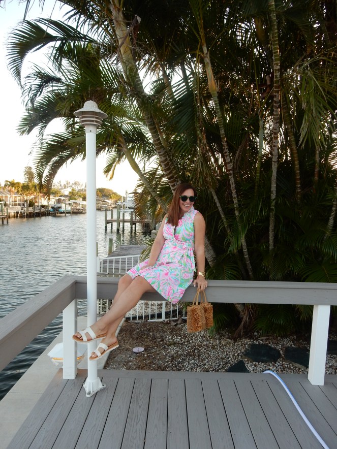 Wrapped in Summer, Lilly Wrap Dress, Lilly Pulitzer Wrap Dress, Mod Fashion, 1960's Fashion, 60s Fashion, Retro Fashion Inspiration, Lilly Pulitzer Print, Lilly Pulitzer History, Green Sunglasses, Lilly Pulitzer Bracelets, Fringe Straw Purse, Fringe Straw Bag, Mod Sandals, Block Sandals, Florida Fashion, Summer Style, Summer 2021 Fashion, Classic Summer Style, Classic Summer Fashion, Blogger Fashion Tips, What to Wear This Summer, What She Wore, Sarah Meyer, SarahInStyle.com, Sarah In Style, Tropical Fashion, Perfect Summer Style, Florida Fashion Blogger, Chicago Fashion Blogger, Loft Purse Sunglass Warehouse, Mermaid Ring, Alex and Ani Ring